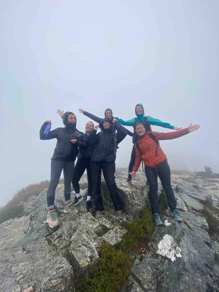 Group at the Top of Lake St. Clair Overlook in Tasmania in the rain