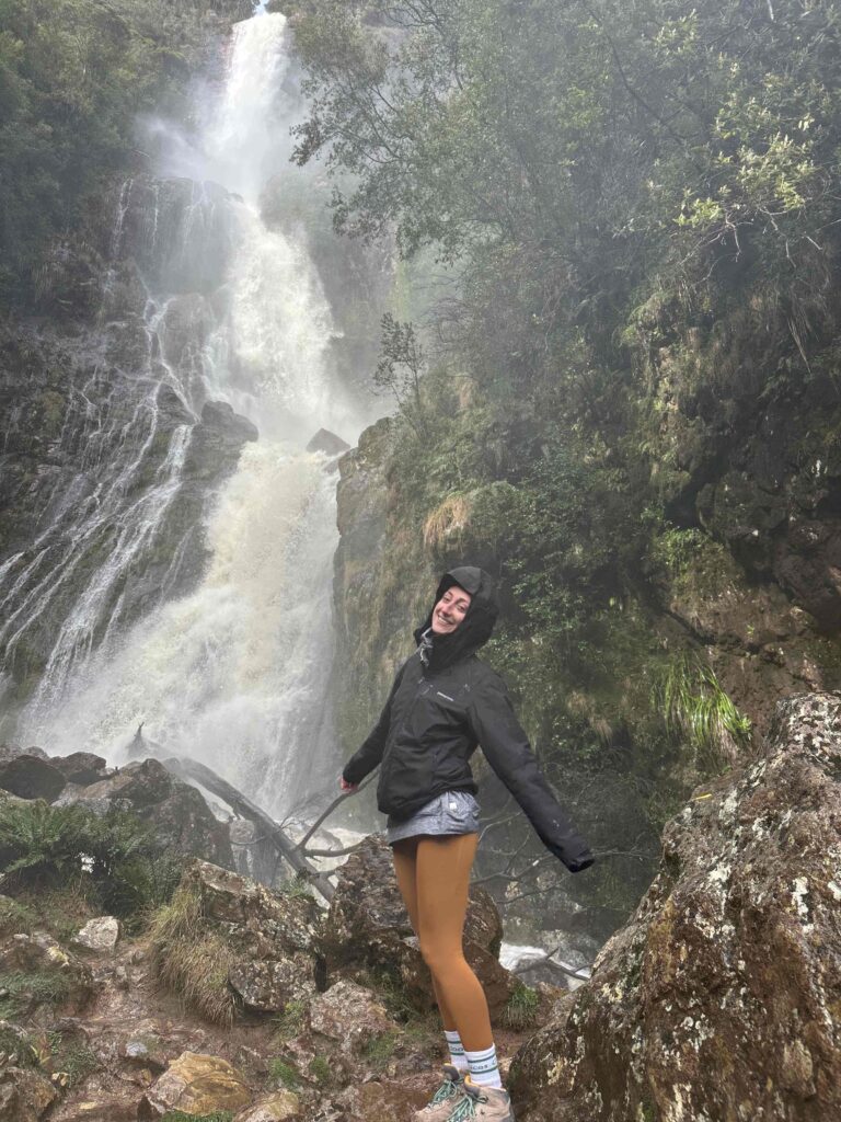 Hiking under Montezuma Falls in Tasmania